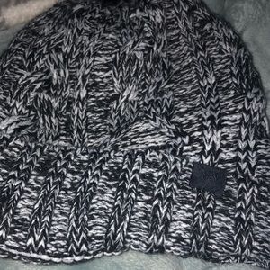 A BLACK AND WHITE HAT FROM PINK